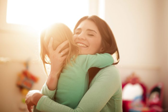 Mother and daughter hugging