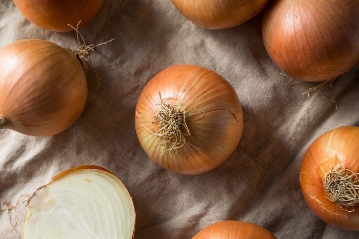 Raw Organic Yellow Sweet Onions Ready to Cook