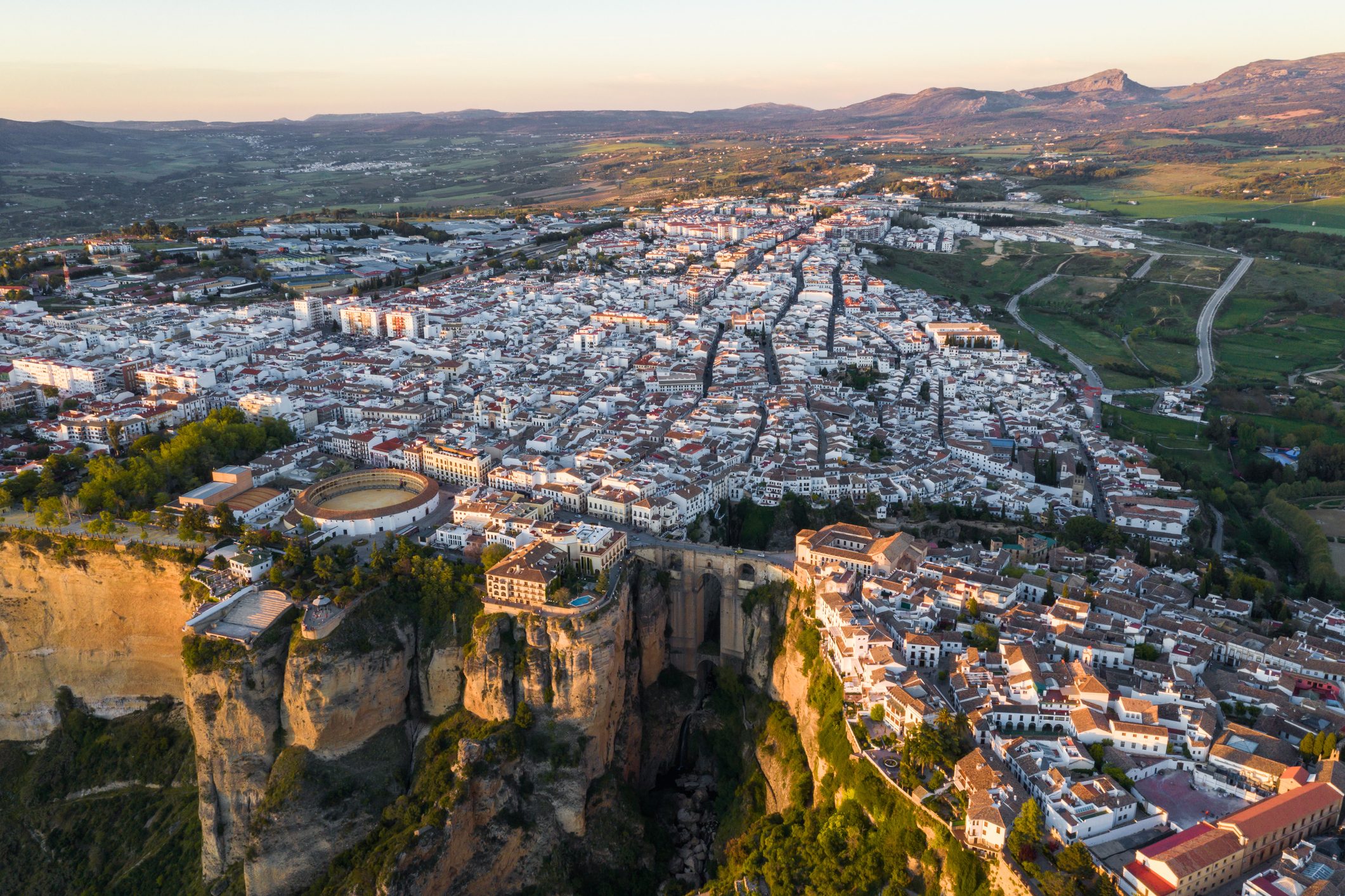 Aerial view of Ronda village, a village with white houses at the edge of cliffside in Andalusia, Spain