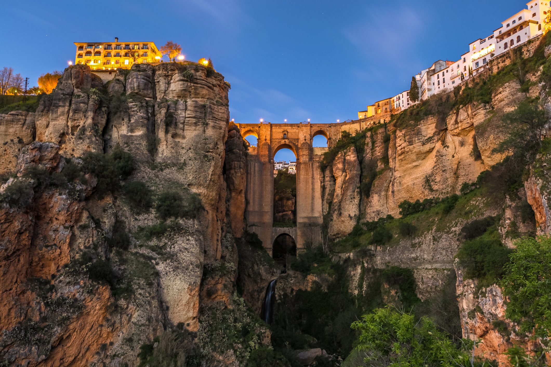 Low Angle View Of Buildings With Bridge Against Sky