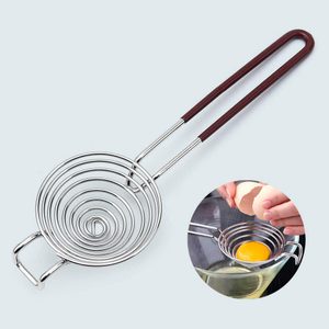 Egg separator rests on light background; used to separate yolk from whites while held over a container.