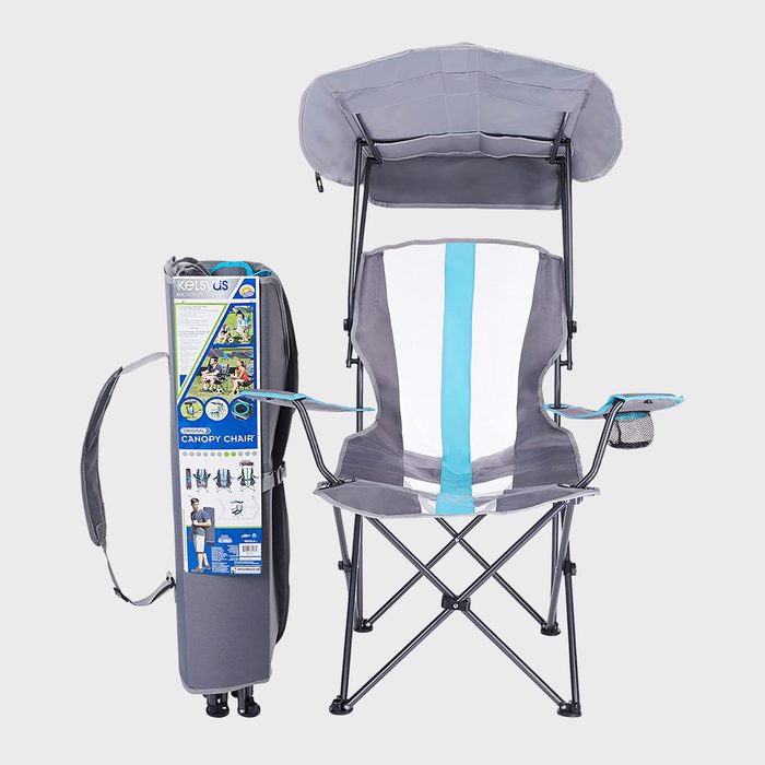 Folding chair with canopy, standing upright beside its carrying case, set against a plain background.