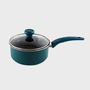 Blue saucepan sits with glass lid, resting on a plain gray background. Handle reads 