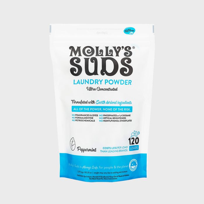 Laundry powder package displays product details, emphasizing eco-friendly ingredients and peppermint scent, designed for all machines, capable of 120 loads, against a plain background.