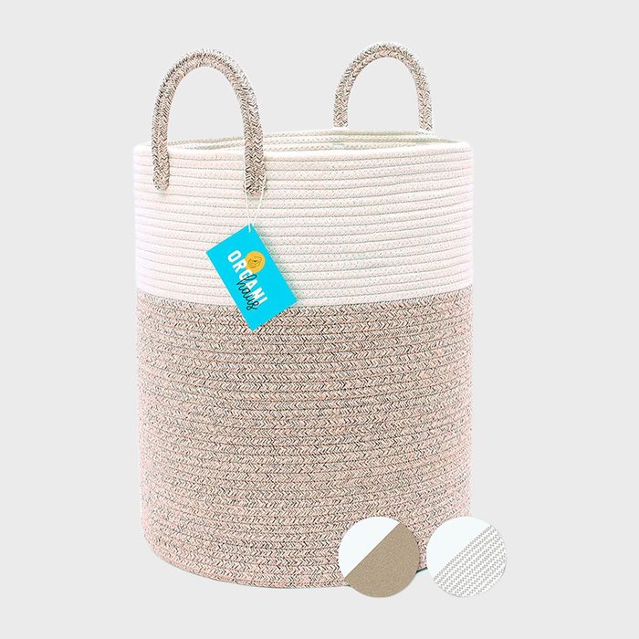 Basket stands upright, displaying a two-tone woven pattern with handles, and a turquoise tag with 