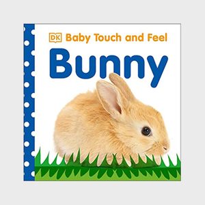 A fluffy brown bunny sits against a white background with green grass. Text reads, 