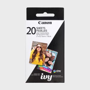 Packaging holds photo paper; two prints are displayed with hashtags. Canon branding is visible. Designed for Ivy mini photo printer, 20 sheets included.