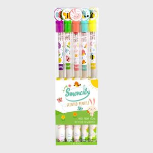 Five clear-cased scented pencils stand upright, topped with colorful designs, in packaging labeled 