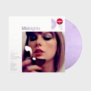 Vinyl record rests beside an album cover depicting a person focusing on lighting a match. The album title is 
