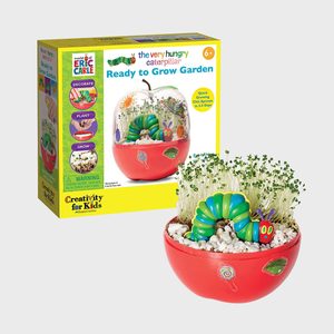 Garden kit includes labeled packaging and apple-shaped planter with sprouts; features a toy caterpillar and white pebbles, themed around a children's book.