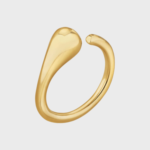 A gold ring forms an open loop with asymmetrical ends, floating against a plain white background.
