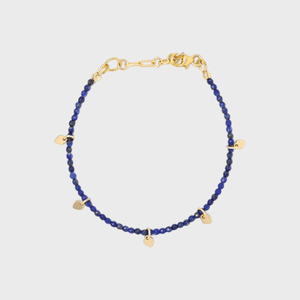 Bracelet features small blue beads and gold heart charms, with a gold clasp, against a plain white background.
