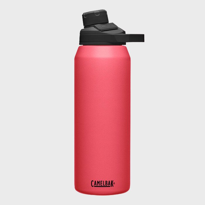 A red water bottle with a black spout lid stands upright on a plain white background. Text reads 