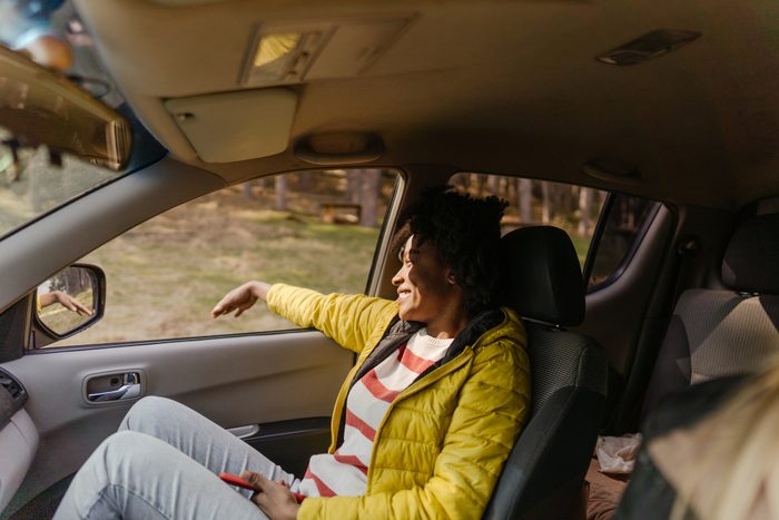 Young woman riding in a car