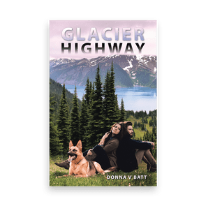A couple sits on grass with a dog, surrounded by trees and mountains beside a lake. Text: 