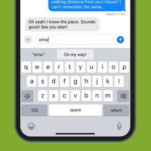 Phone displays a conversation with a keyboard at the bottom, showing a text suggesting a meeting. The screen background is green.