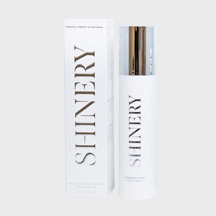 Bottle stands with box; both labeled 
