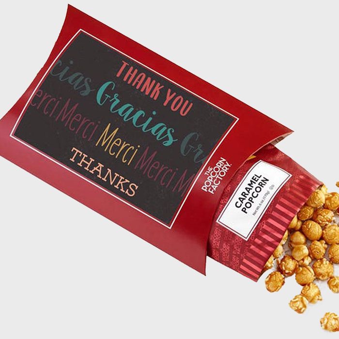Red package dispenses caramel popcorn, labeled with 