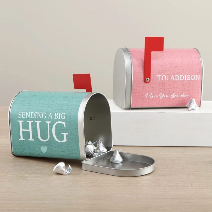 Mini mailboxes hold chocolate kisses; one teal says, 