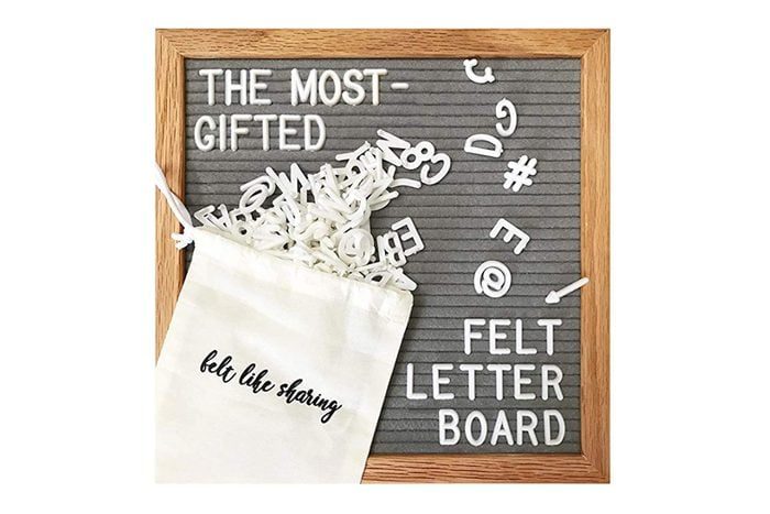 Felt letterboard displays scattered letters. Text reads 