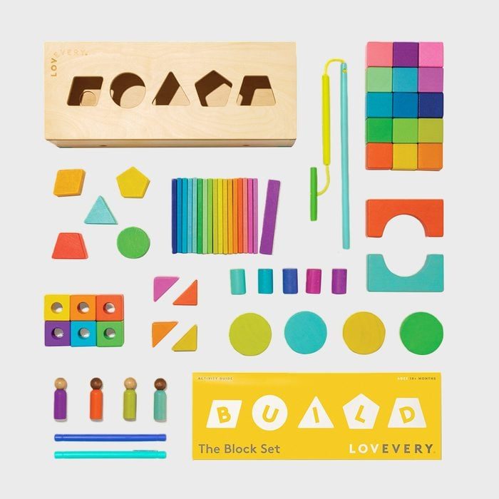 Wooden blocks are neatly arranged; various colorful shapes and figures provide playful arrangement; set includes text: 