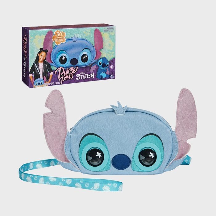 Blue cartoon character purse features large ears, with a playful design on a plain gray background. Product box in the top left corner.