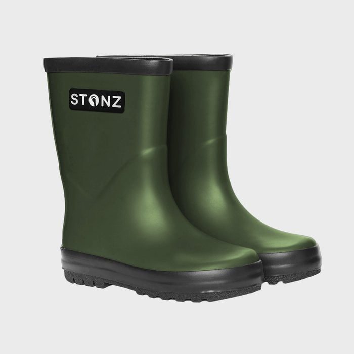 Green rubber boots stand on a plain background; 